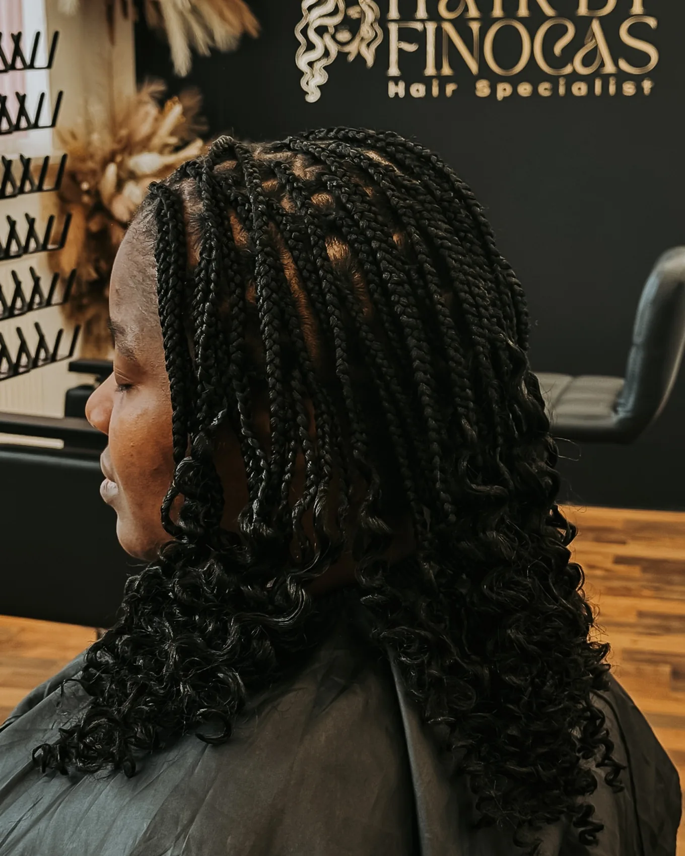Braided hairstyle finished with defined curls