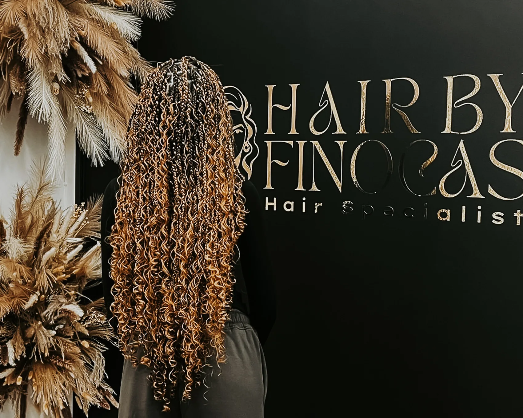 Long curly braids with warm golden tones