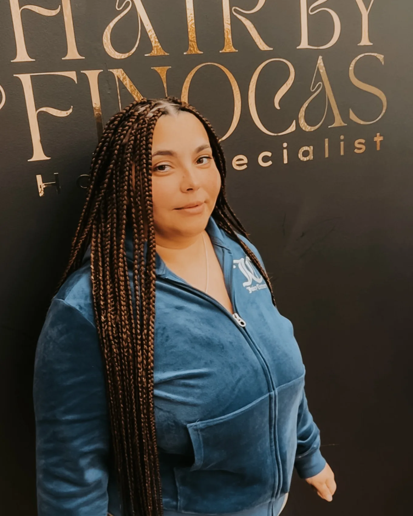 Long box braids styled over one shoulder