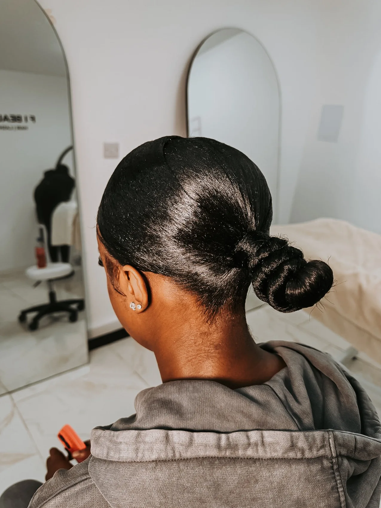Detailed view of a sleek low bun