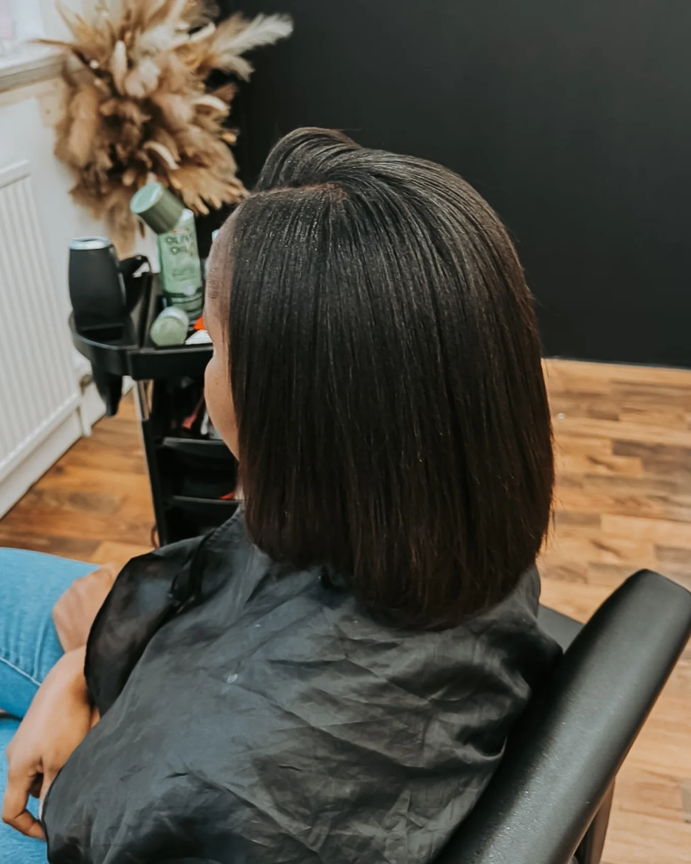 Sleek shoulder-length bob hairstyle completed at Hair by Finocas