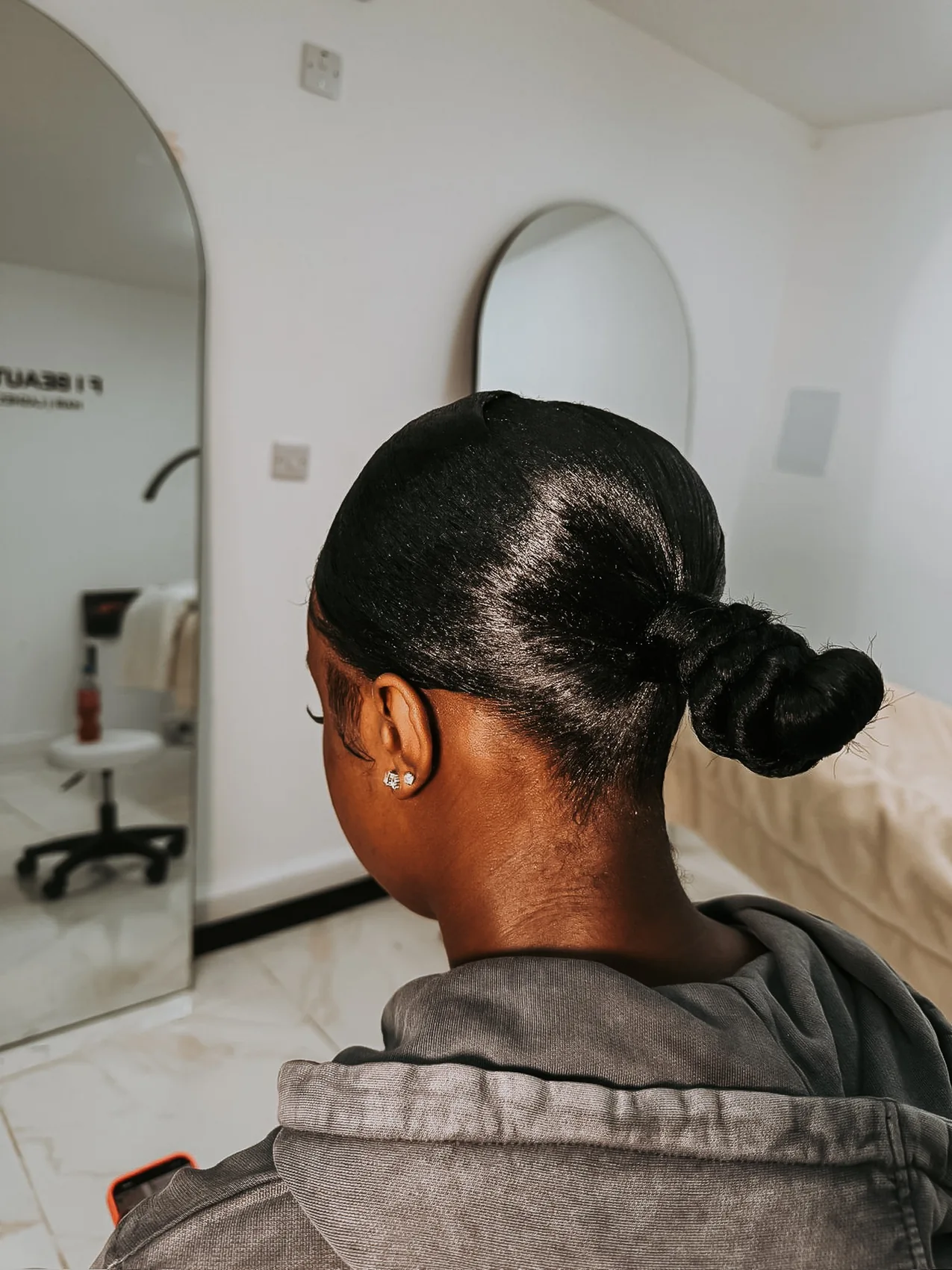 Polished low bun hairstyle viewed from the back