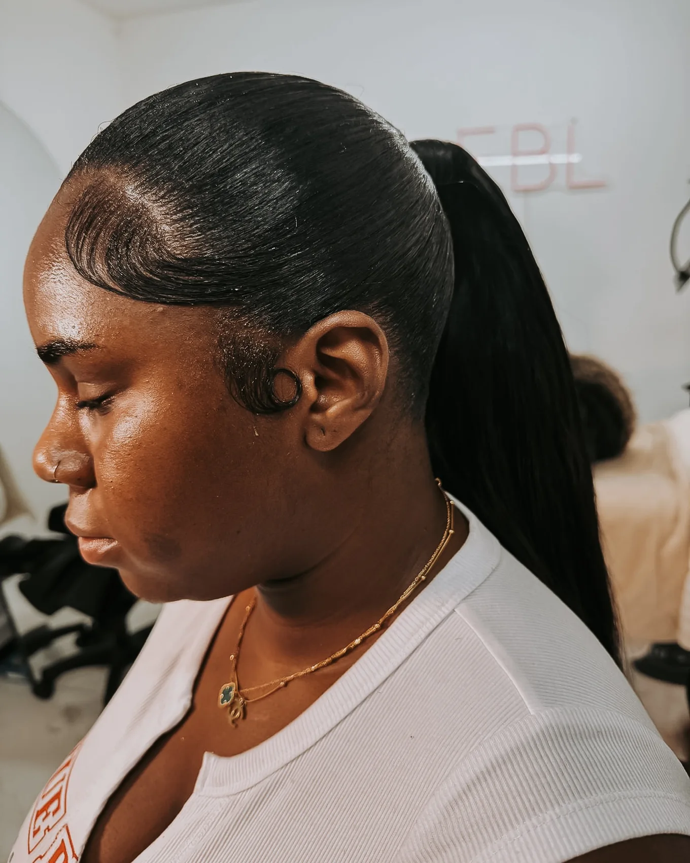 Sleek ponytail with styled edges