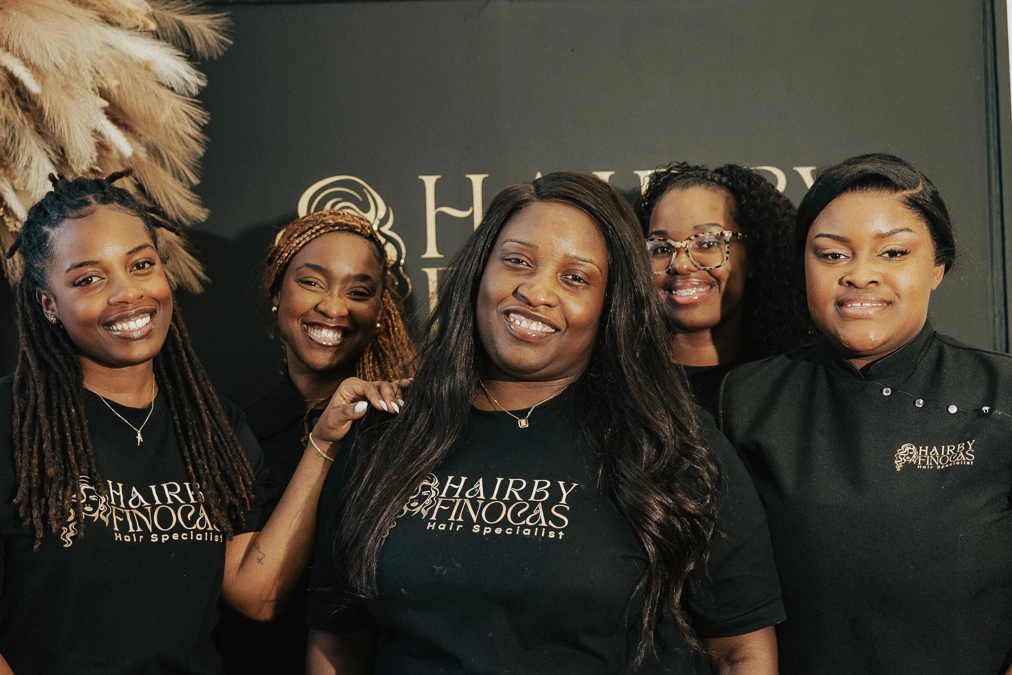 Hair by Finocas team smiling together